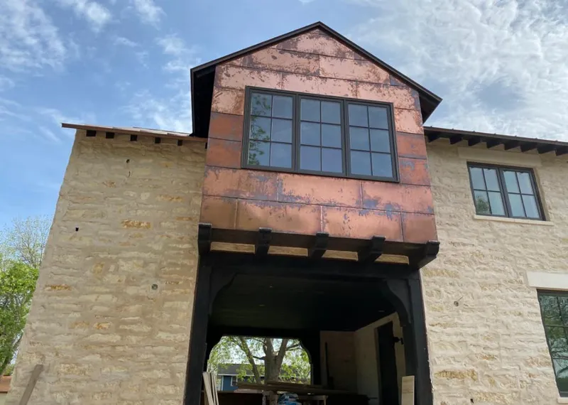 Copper metal panel facade on a stone building for Metal Roof Coating in Northvale